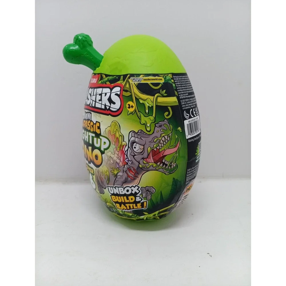 Zuru Smashers Mini Jurassic Light Up Dino Green Bone 6 Surprises Slime Egg ~NWT